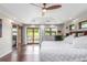 This main bedroom has a ceiling fan and a door leading to the outdoor area at 5727 Colorow Dr, Morrison, CO 80465