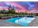 Beautiful swimming pool at sunset offers a tranquil escape with picturesque views of the rolling countryside at 5727 Colorow Dr, Morrison, CO 80465