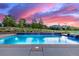 The swimming pool boasts a waterfall feature and a hot tub, perfect for enjoying outdoor living at 5727 Colorow Dr, Morrison, CO 80465
