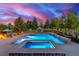 Relaxing pool and hot tub in a serene backyard setting with lush landscaping at 5727 Colorow Dr, Morrison, CO 80465