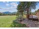 Backyard with a tree swing overlooking mountain views at 30651 Hollings Way, Golden, CO 80403