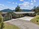 Ranch-style home with a detached garage and mountain views at 30651 Hollings Way, Golden, CO 80403