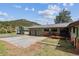Home's exterior with an oversized driveway at 30651 Hollings Way, Golden, CO 80403