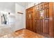 Foyer with tile flooring and decorative wooden doors at 30651 Hollings Way, Golden, CO 80403
