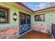 Covered front porch with double doors at 30651 Hollings Way, Golden, CO 80403