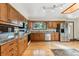 Updated kitchen with stainless steel appliances, granite countertops, hardwood flooring, and natural light at 30651 Hollings Way, Golden, CO 80403