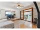 Open living space with dining area, wood-burning stove, and access to additional living space at 30651 Hollings Way, Golden, CO 80403