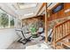 Bright sun room with tiled floors, skylights, and comfortable chairs at 30651 Hollings Way, Golden, CO 80403