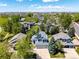 Aerial view of home featuring mature trees and a lush green lawn in quiet neighborhood at 10765 Fremont Dr, Parker, CO 80134