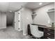 Finished basement office with built-in shelves, desk area and carpet flooring at 10765 Fremont Dr, Parker, CO 80134
