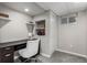 Finished basement office featuring built-in shelves and desk area at 10765 Fremont Dr, Parker, CO 80134