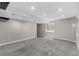 Large finished basement featuring neutral walls, gray carpet, and recessed lighting at 10765 Fremont Dr, Parker, CO 80134