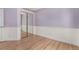 Cozy bedroom with mirrored closet, two-tone paint, and hardwood floors at 10765 Fremont Dr, Parker, CO 80134