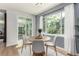 Bright dining area with a round table and chairs, offering a view of the backyard at 10765 Fremont Dr, Parker, CO 80134