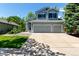 Charming two-story home with a well-maintained lawn, spacious driveway, and attached two-car garage at 10765 Fremont Dr, Parker, CO 80134