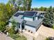 Charming two-story home with a gray roof, solar panels, well-maintained landscaping, and attached two car garage at 10765 Fremont Dr, Parker, CO 80134