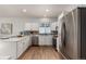 Well-equipped kitchen with stainless steel appliances and a mosaic tile backsplash at 10765 Fremont Dr, Parker, CO 80134