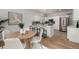 Well-lit kitchen with stainless steel appliances, a large island, and a dining area at 10765 Fremont Dr, Parker, CO 80134