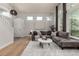 Stylish living room featuring hardwood floors, contemporary furniture, and ample natural light at 10765 Fremont Dr, Parker, CO 80134