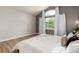 Spacious main bedroom with vaulted ceilings, window views, and plush bedding at 10765 Fremont Dr, Parker, CO 80134