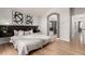 Inviting main bedroom boasts hardwood floors, neutral tones, and ensuite access at 10765 Fremont Dr, Parker, CO 80134