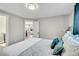 Main bedroom with view into kitchen and gray walls at 1322 W Alaska Pl, Denver, CO 80223