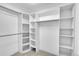 Spacious walk-in closet with ample shelving and hanging rods at 1322 W Alaska Pl, Denver, CO 80223