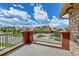 Residential view from a private balcony overlooking a charming neighborhood with lush landscaping at 9538 Pendio Ct, Highlands Ranch, CO 80126