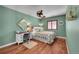 Cozy bedroom with a ceiling fan, a desk by the window, and hardwood floors at 9538 Pendio Ct, Highlands Ranch, CO 80126