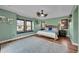 Charming bedroom featuring a window seat and hardwood floors, bathed in natural light at 9538 Pendio Ct, Highlands Ranch, CO 80126