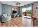 Bonus room featuring hardwood floors, ceiling fan, and sliding glass doors to a private balcony at 9538 Pendio Ct, Highlands Ranch, CO 80126