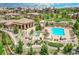 Community pool and lounge area featuring a swimming pool, hot tub, pergola, and seating at 9538 Pendio Ct, Highlands Ranch, CO 80126