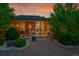 Back porch with lovely stone work, outdoor seating, flower pots, and garden at 56920 E 42Nd Ct, Strasburg, CO 80136