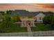 Aerial view of backyard with pergola, brick patio, and manicured landscaping at 56920 E 42Nd Ct, Strasburg, CO 80136