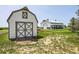 Image showcasing two barns on a spacious property featuring distinct designs and ample outdoor space at 56920 E 42Nd Ct, Strasburg, CO 80136