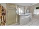 Bathroom featuring a soaking tub with tiled surround and glass enclosed shower at 56920 E 42Nd Ct, Strasburg, CO 80136