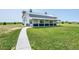 Spacious barn on a large lot with a welcoming porch and ample green space at 56920 E 42Nd Ct, Strasburg, CO 80136