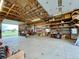 Spacious garage or shop area with high ceilings, open layout, and great natural light at 56920 E 42Nd Ct, Strasburg, CO 80136