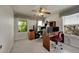 Comfortable office space with multiple computer setups and natural light at 56920 E 42Nd Ct, Strasburg, CO 80136
