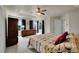 Bright main bedroom featuring large windows, plush carpet, and ample closet space at 56920 E 42Nd Ct, Strasburg, CO 80136