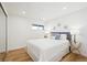 Bright bedroom with white bedding and modern decor at 14800 Foothill Rd, Golden, CO 80401