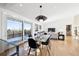 Open concept dining area with glass table and modern chairs at 14800 Foothill Rd, Golden, CO 80401