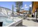 Relaxing hot tub on patio with seating area and mountain views at 14800 Foothill Rd, Golden, CO 80401