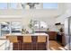 Modern kitchen with island, stainless steel appliances, and white quartz countertops at 14800 Foothill Rd, Golden, CO 80401