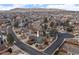 Aerial view of the property in a mature neighborhood with mountain views at 2490 S Coors St, Lakewood, CO 80228