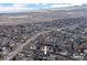 An eye-level drone view of the property, nestled in a suburban community at 2490 S Coors St, Lakewood, CO 80228