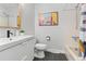 Traditional bathroom with modern vanity, shower over bath, and neutral decor at 2490 S Coors St, Lakewood, CO 80228