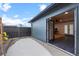 Exterior shot of shed/bonus room, featuring modern bi-fold glass doors and siding at 2490 S Coors St, Lakewood, CO 80228