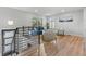 Upstairs view of a modern living area with hardwood floors, a comfortable sofa, and bright natural light at 2490 S Coors St, Lakewood, CO 80228