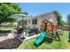 Backyard featuring a patio, play set, and garden boxes at 5332 S Lisbon Way, Centennial, CO 80015